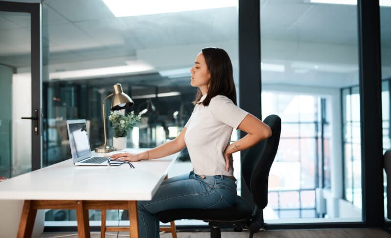 Back Pain Management -experiencing-back-pain-while-working-in-an-office