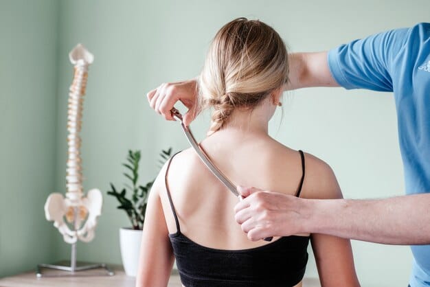 Soft Tissue Manipulation-treatment-girl-receiving-soft-tissue-treatment-her-neck-with-stainless-steel-tool-soft-tissue-mobilization